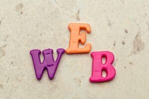 Colorful letters on background closeup, word web
